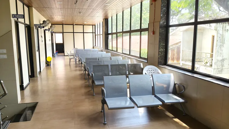 Patient waiting area with seating along the hospital corridor